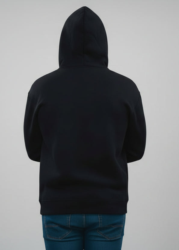Person wearing a black hoodie from behind on a gray background