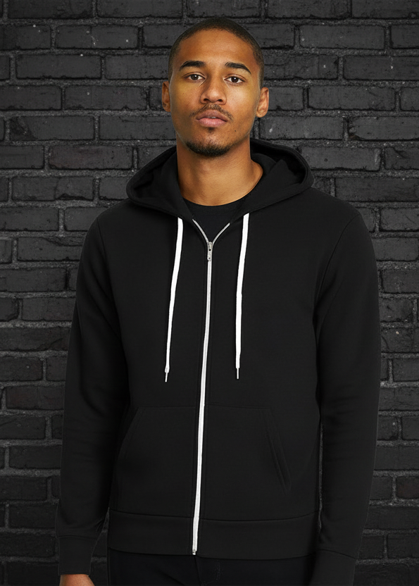 Man wearing a black hoodie with a white zipper on a white background