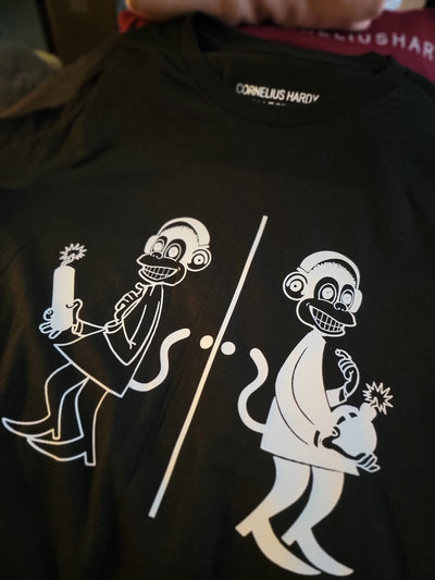Black t-shirt with white graphic design of a skeleton and a ghost holding a sword.